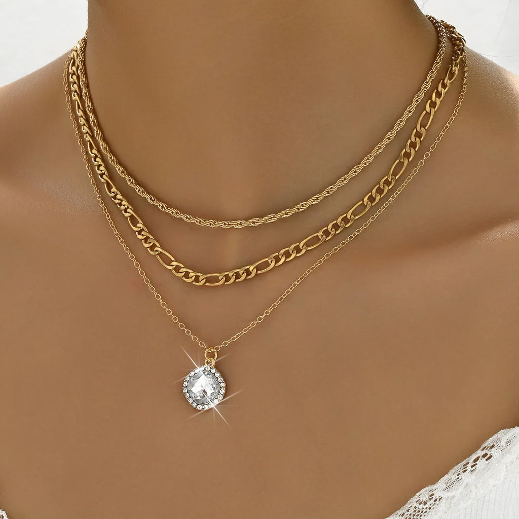 Gold multi-layer pendant necklace with large hemp flowers chain and round geometric pendants on alloy base