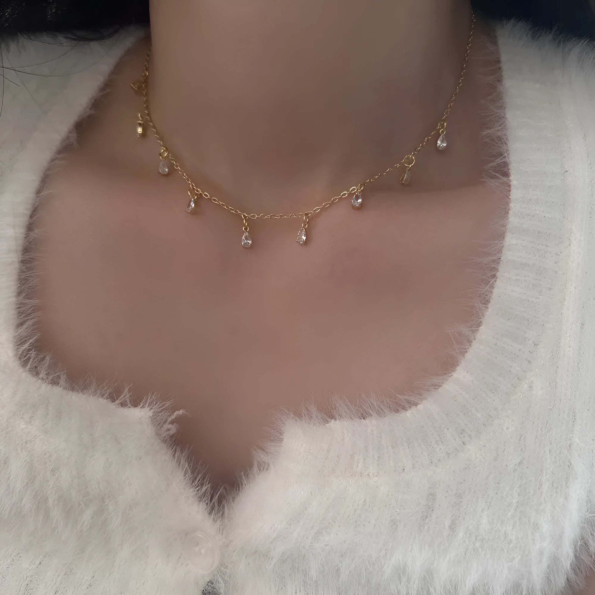 Women's zircon necklace, earrings, and anklet set with geometric pendant and meteor shower design.