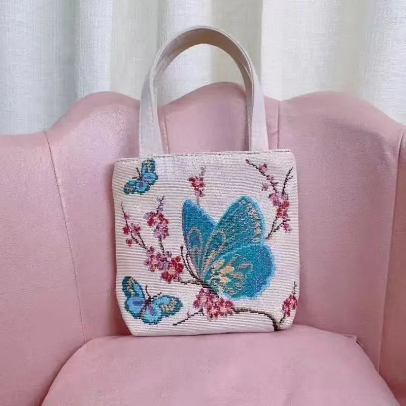 Double-sided gold wire embroidered canvas handbag in small, medium, and large sizes with patterned options.