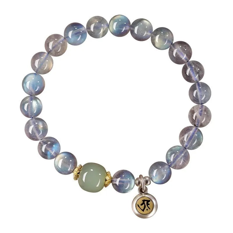 Moonstone bracelet with 8mm beads and a silver Guanyin mouse zodiac charm on a black background.