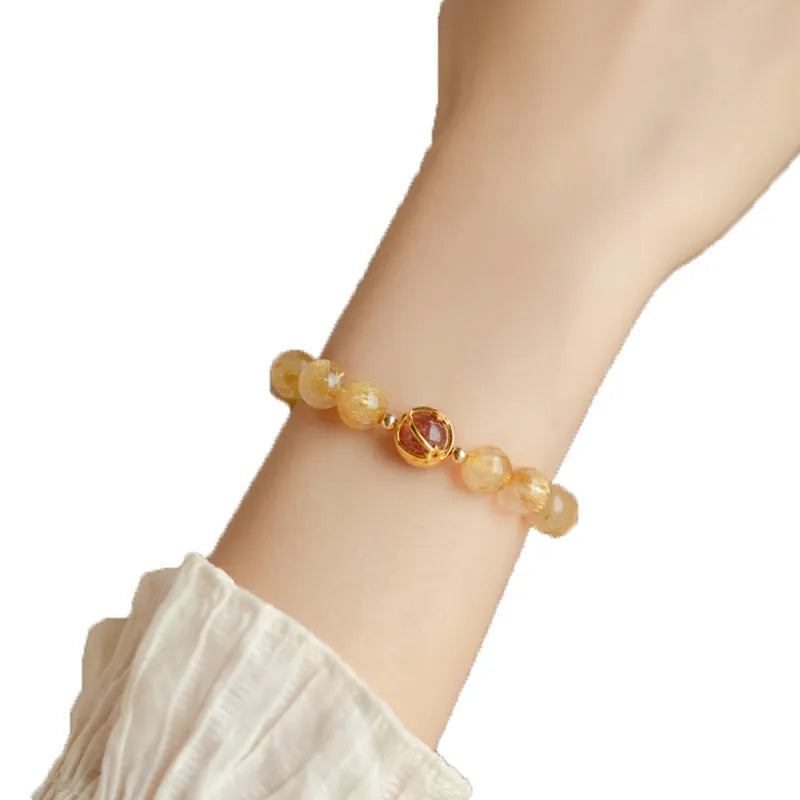Natural citrine and gold rutilated quartz crystal bracelet with diamond-shaped beads