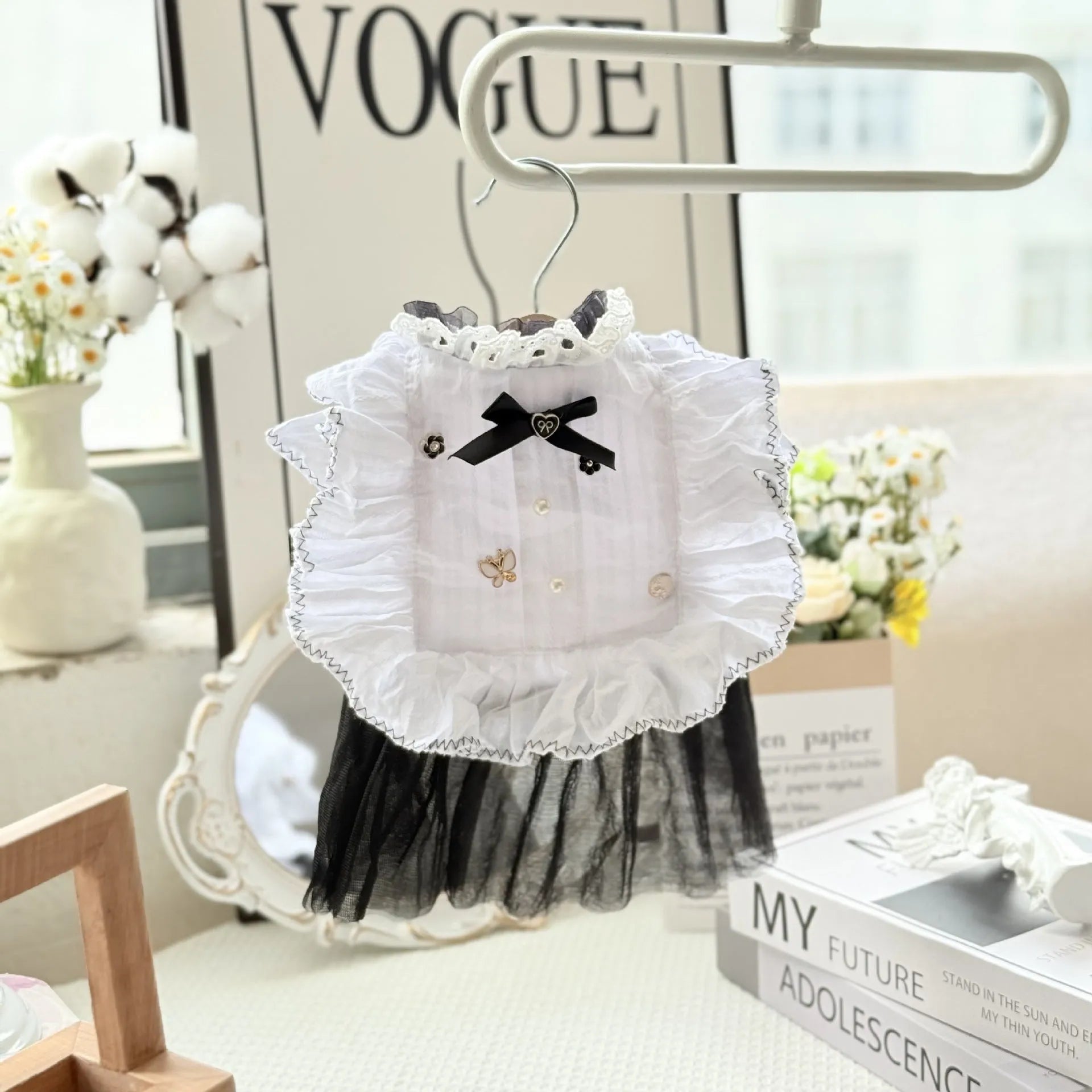 White yarn gauze skirt for small dog on a table, showing princess-style tiered design and lightweight fabric.