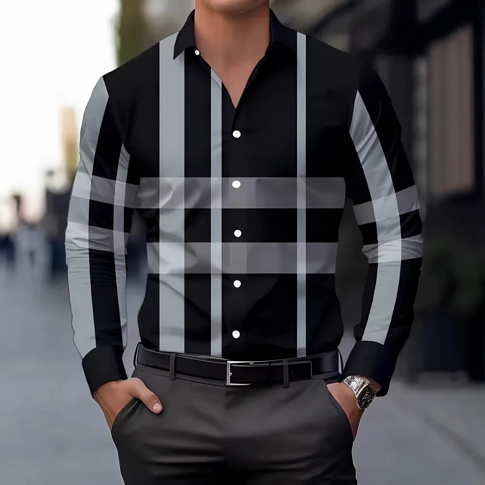 Man wearing a striped long sleeve button-down shirt in blue, showing the collar and cuffs.