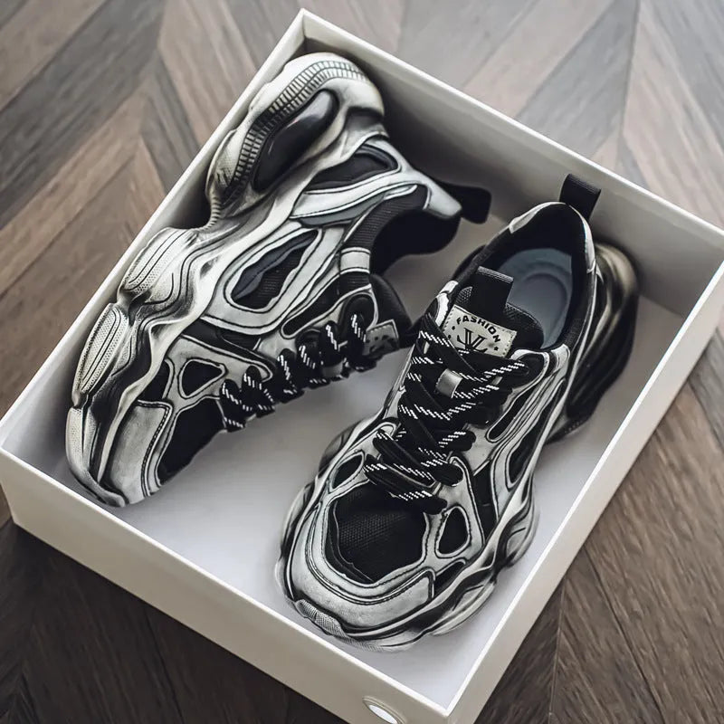 Men's black and grey mesh sneakers with a platform heel, round toe, and cross strap detail on a white background.