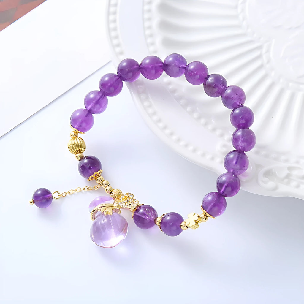 Purple amethyst crystal bracelet with ethnic money bag pendant and peace buckle closure