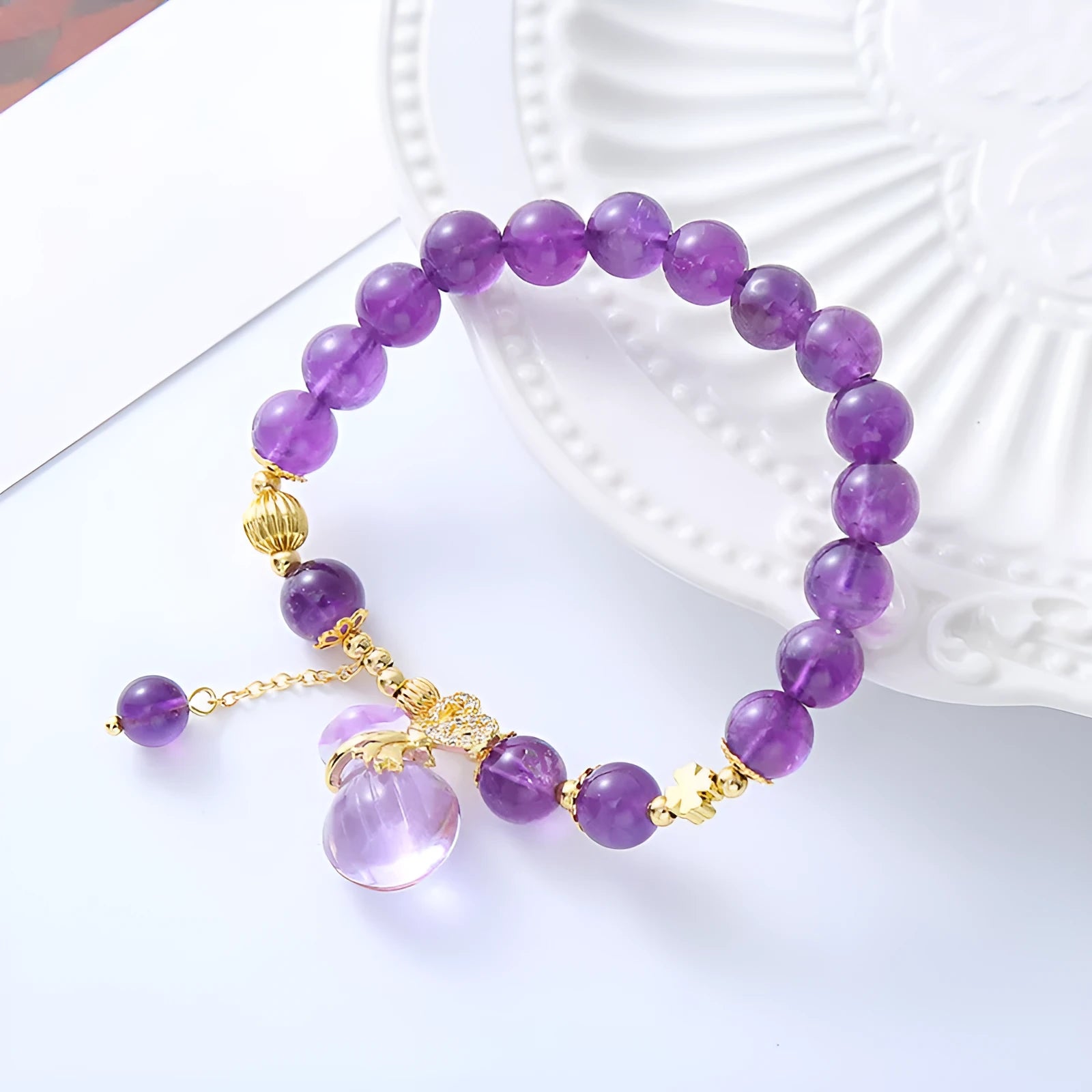 Purple amethyst crystal bracelet with ethnic money bag pendant and peace buckle closure