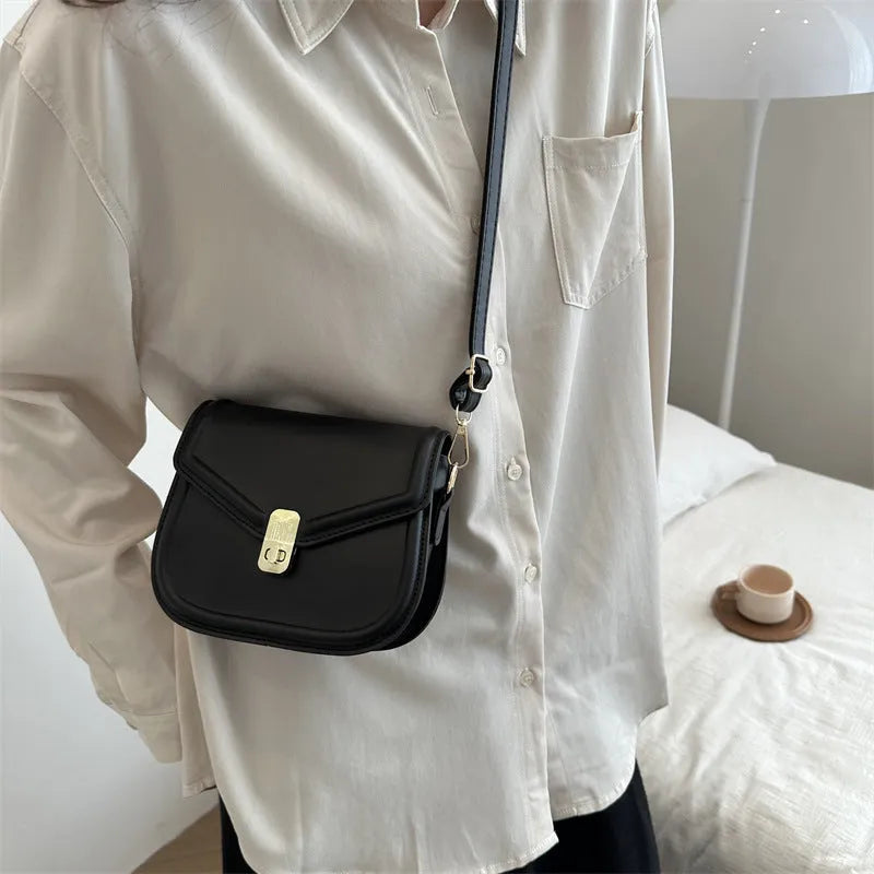 Soft PU clamshell messenger bag in horizontal square shape on a shoulder strap.