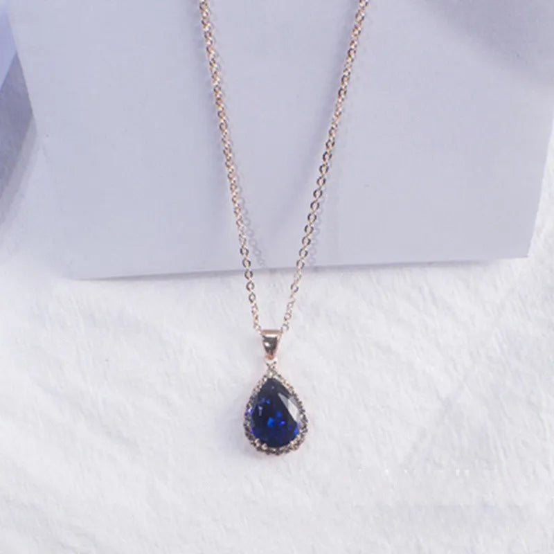 Women's rose gold geometric drop necklace with rhinestone inlay in pink colour