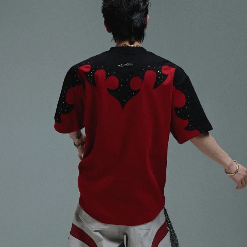 Men's red short sleeve shirt with 3D burnt flower embroidery and rhinestone details on a loose drop shoulder fit.
