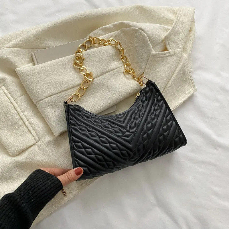 Brown vertical PU leather shoulder bag with a silver pleated chain strap and a soft handle.