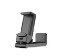 A black foldable phone holder with a rotating base, shown holding a mobile phone in landscape orientation.
