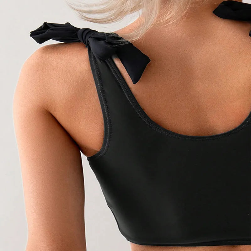 Women's coconut print bikini swimsuit with lace-up detail on a hanger
