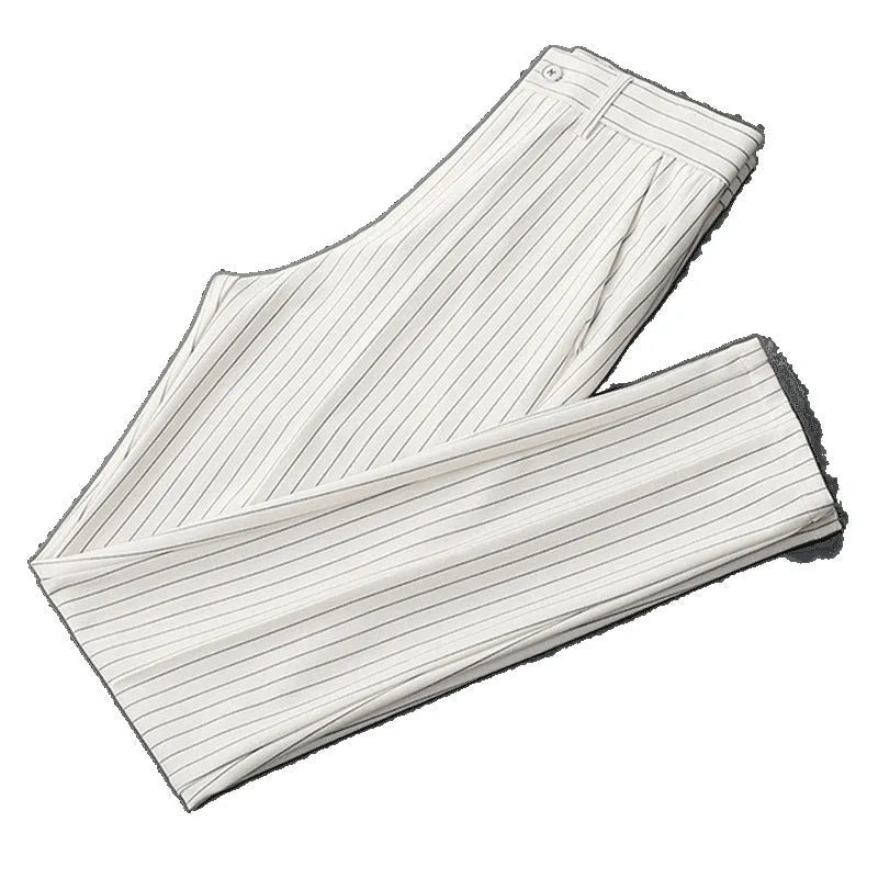Man wearing thin striped loose-fit casual trousers in a drape style, shown in black and white colour options.