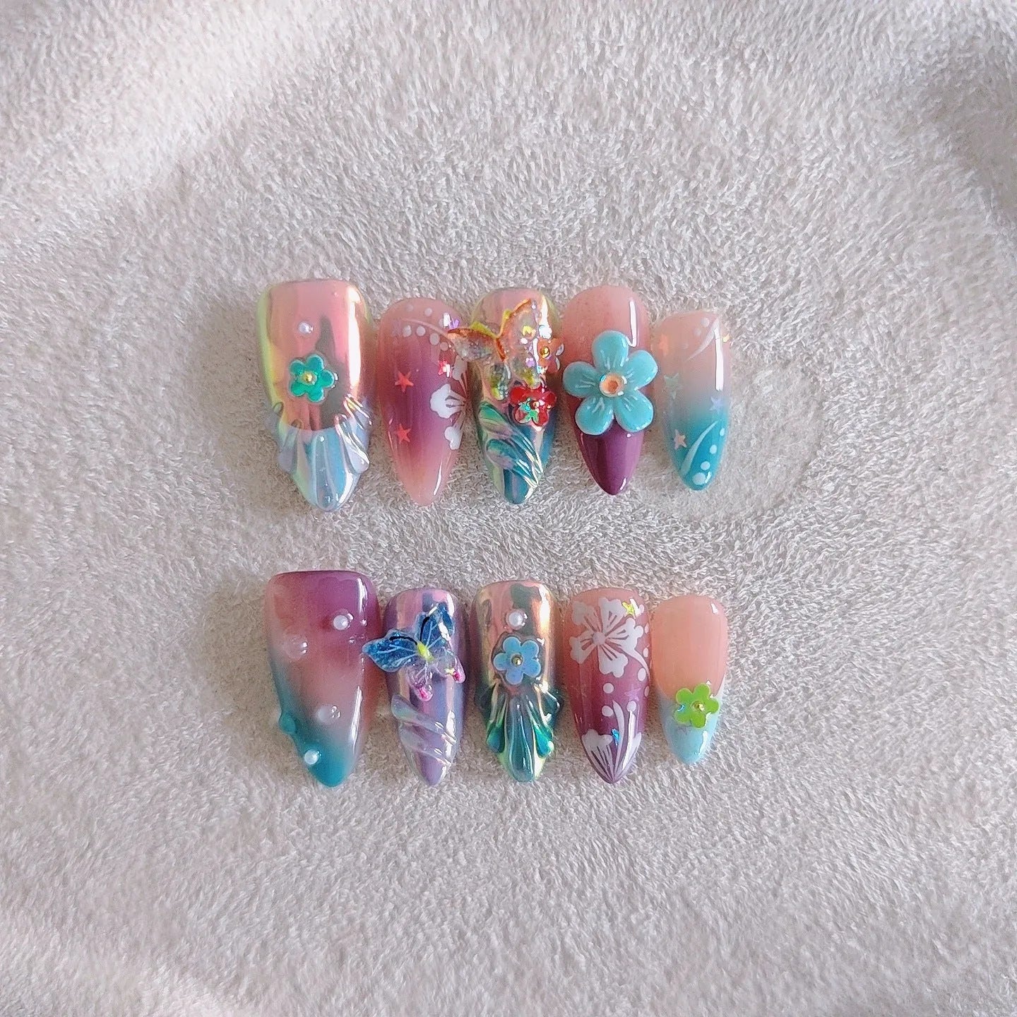 Handmade nail art stickers with colourful floral and butterfly embossed designs