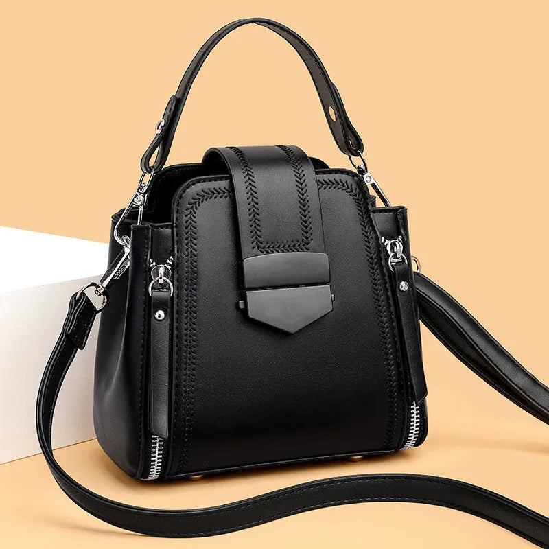 Soft textured PU leather small square handbag for women in multiple colour options showing sewing thread detail.