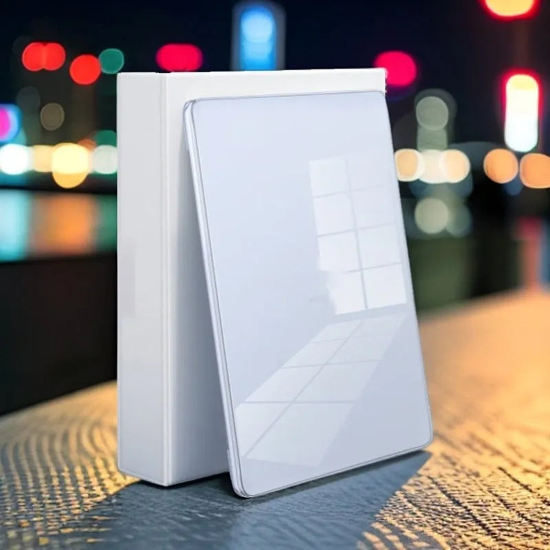 Transparent plastic protective shell case for a MacBook laptop on a table.