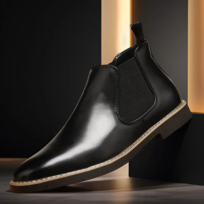 Men's black British-style mid-calf oversleeve boots with a flat square heel on a white background.