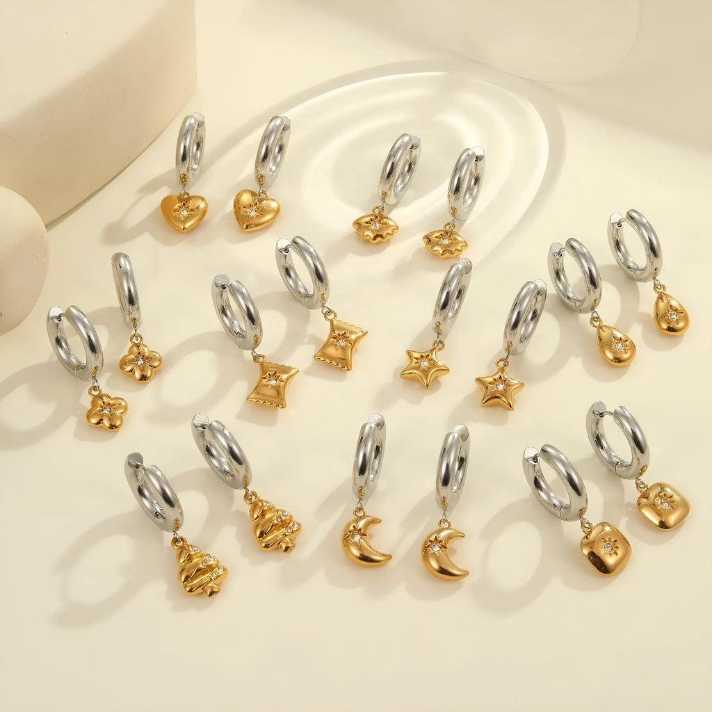 Women's stainless steel earrings with 18K gold plating in heart, star, and Christmas tree shapes.
