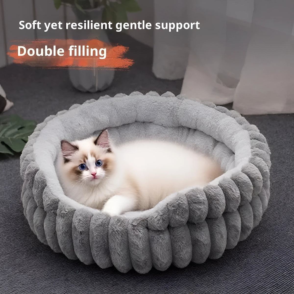 Round plush cat bed in grey, 50cm diameter, on a wooden floor