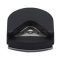 Black plastic and metal business card corner cutter on a white background.