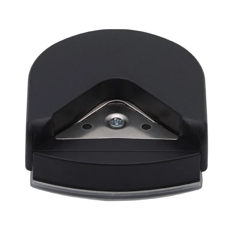 Black plastic and metal business card corner cutter on a white background.