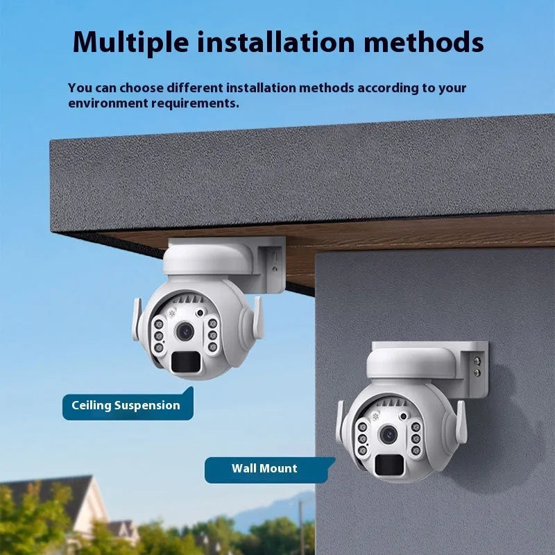 White solar-powered security camera with solar panel on top, mounted on an outdoor wall.
