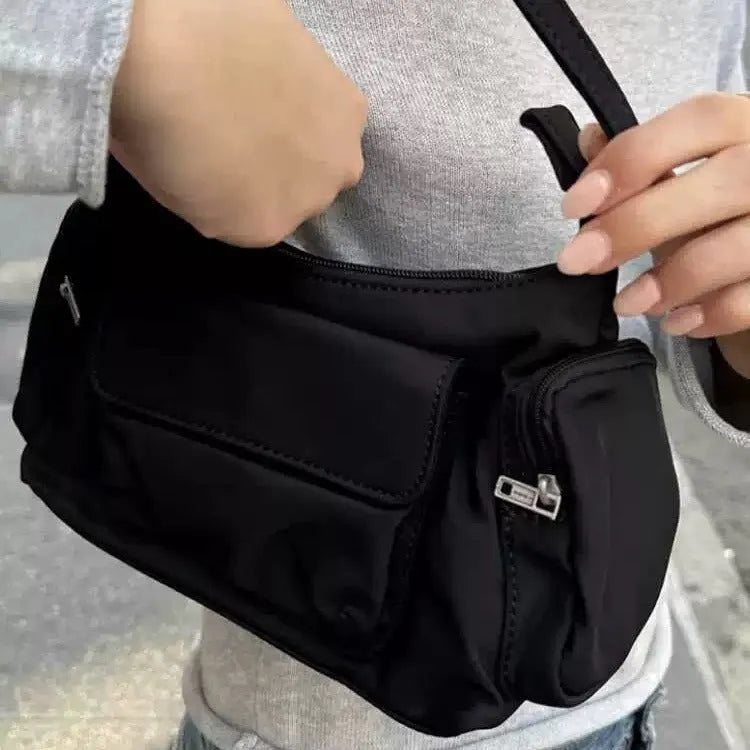 Black PU nylon women's shoulder bag with two pockets and side line detail showing dimensions