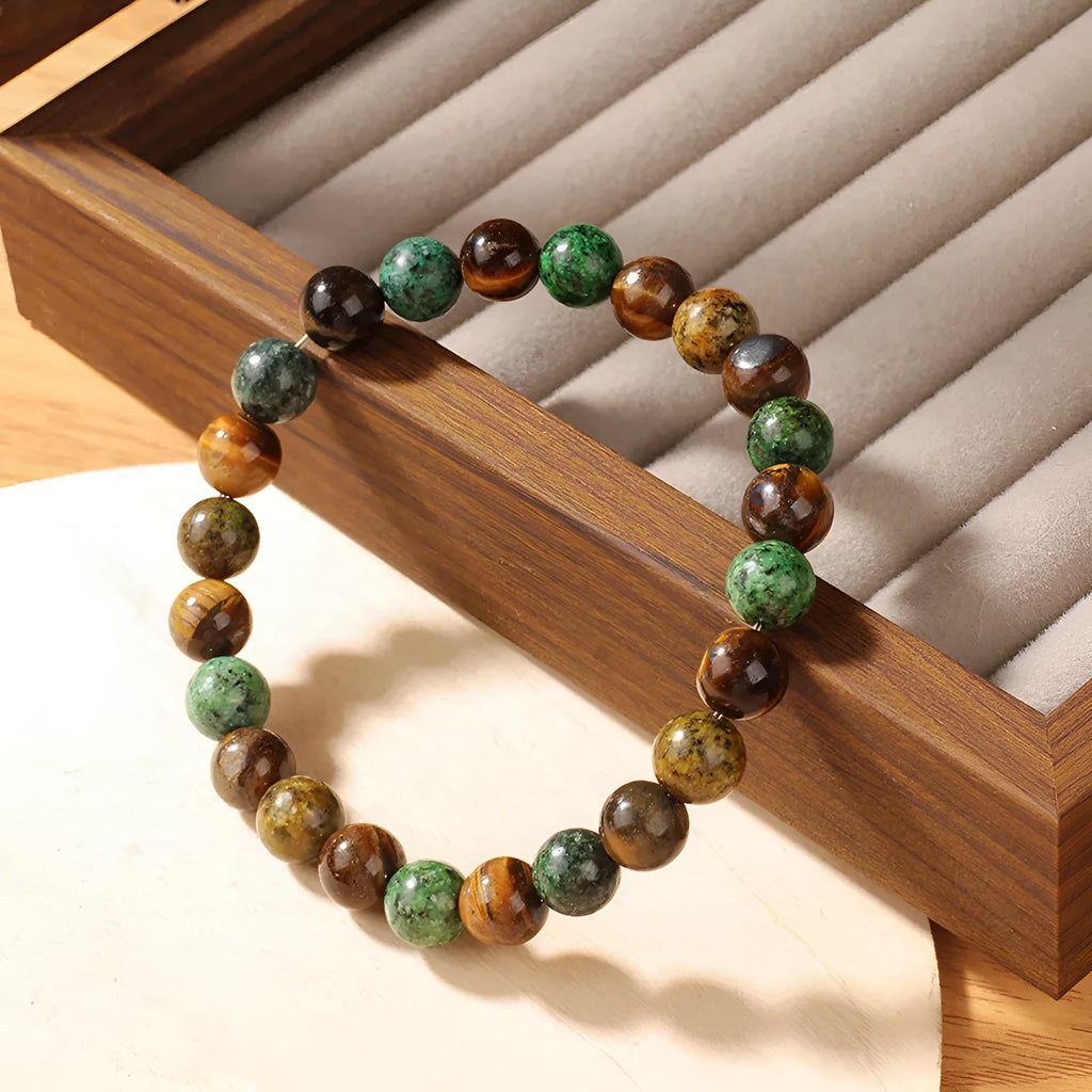 Handmade tigereye stone bracelet with antique floral design and adjustable cord fastening