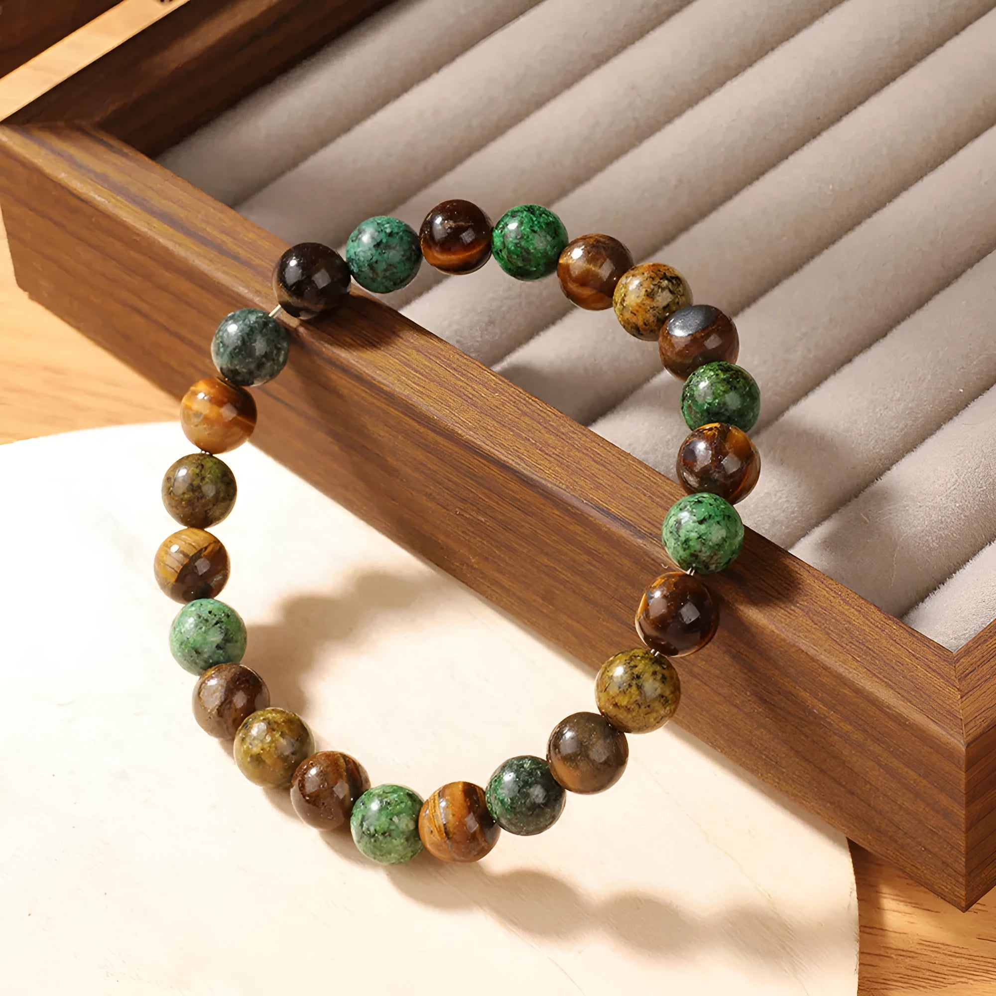 Handmade tigereye stone bracelet with antique floral design and adjustable cord fastening