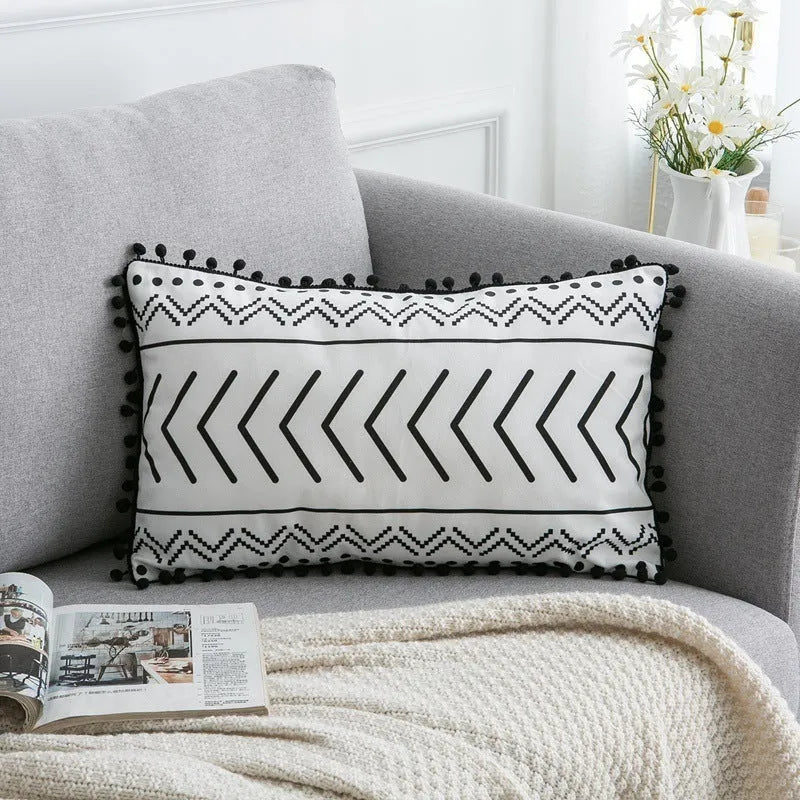 Bohemian national style polyester cushion cover in light grey on a sofa.