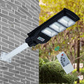 Integrated solar-powered 60W LED street light unit for outdoor installation.