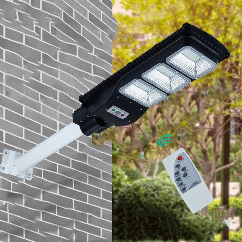 Integrated solar-powered 60W LED street light unit for outdoor installation.