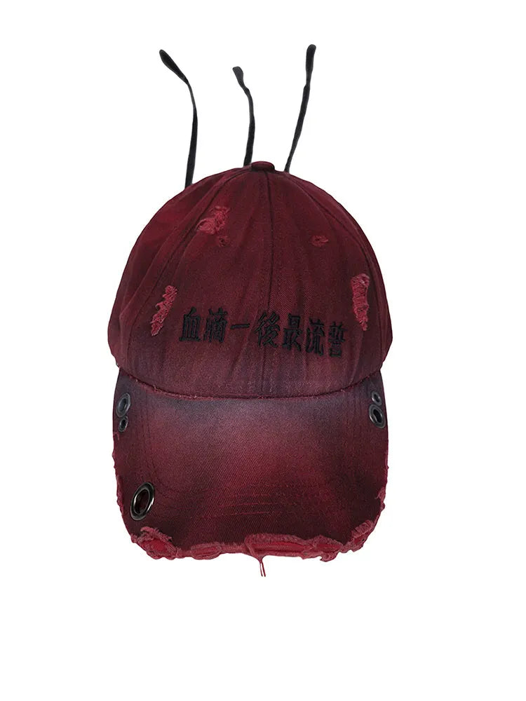 Rose red distressed peaked baseball cap with adjustable back strap and spray-painted vintage finish