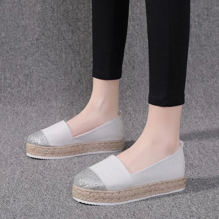 Plus size canvas flats in breathable cloth with round toe design and slip-on construction