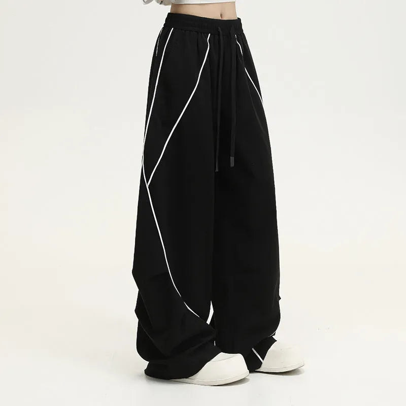 Black striped wide-leg hip hop sports pants with a mid waist and loose fit.