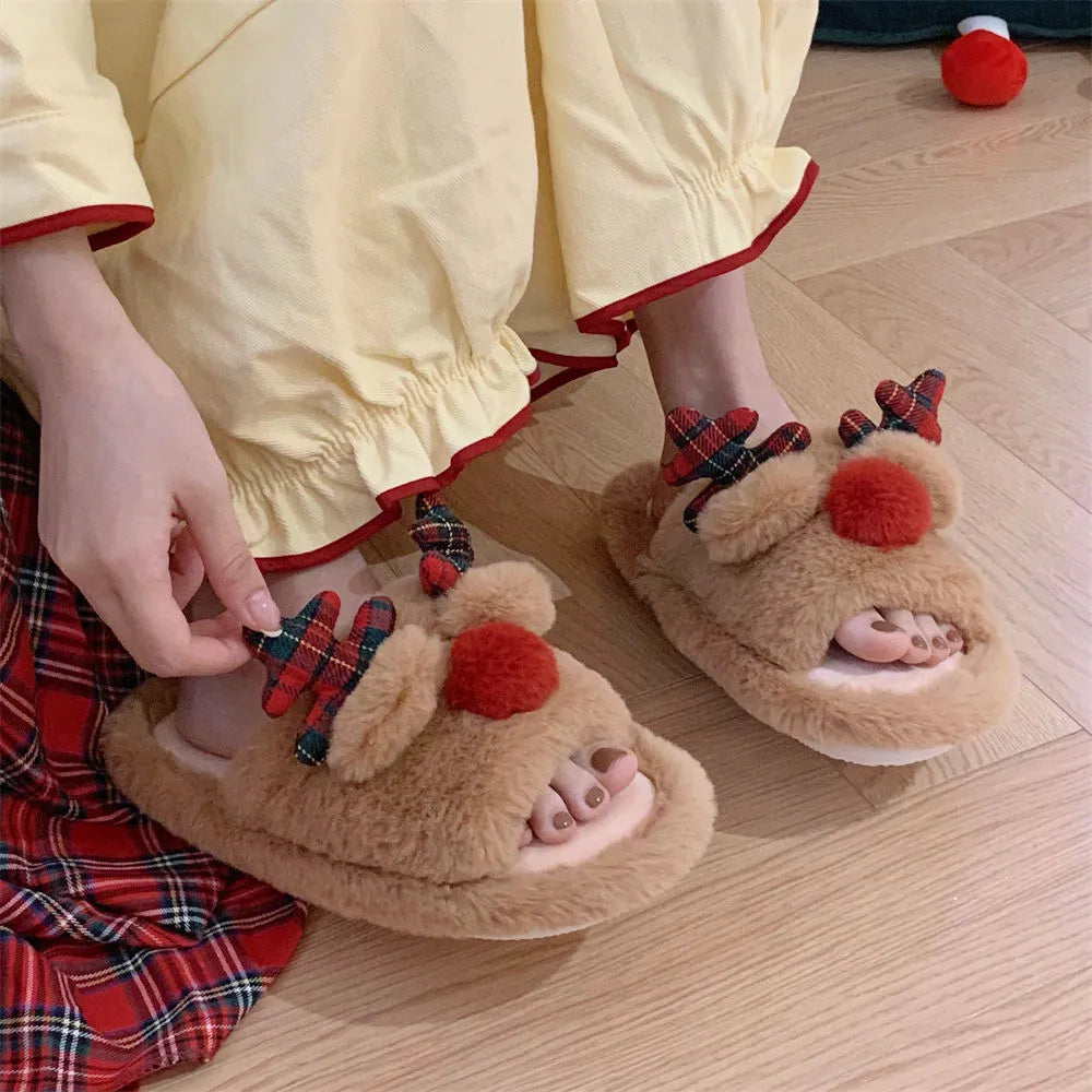 Brown women's slippers with a cartoon deer design, suede upper, and PVC sole.