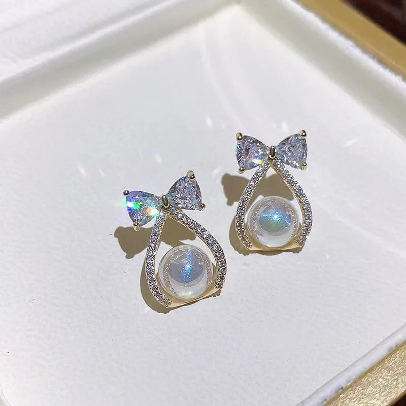 Women's alloy bow earrings with electroplating finish in colour as shown in main image