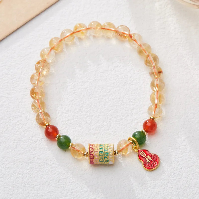 Hand-woven unisex bracelet with 6mm citrine beads in a five-sutra braid design.