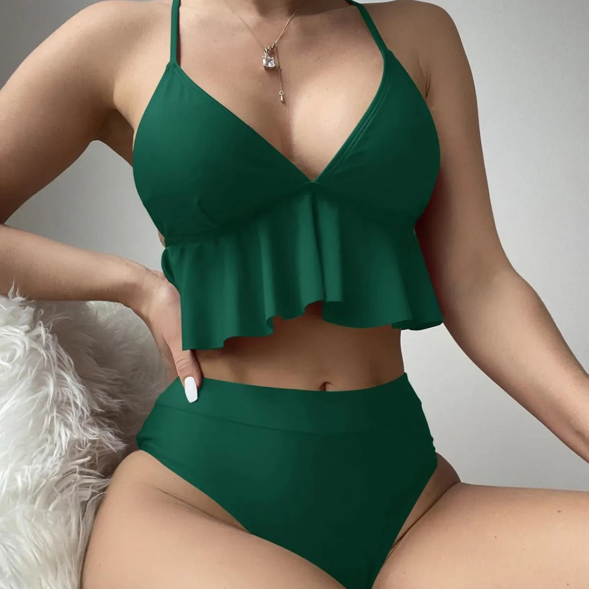 Women's solid colour split bikini swimsuit in black on a model