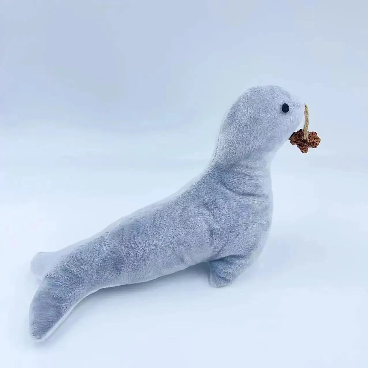 Blue sea lion shaped plush cat toy with bell, catnip section and teeth grinding texture