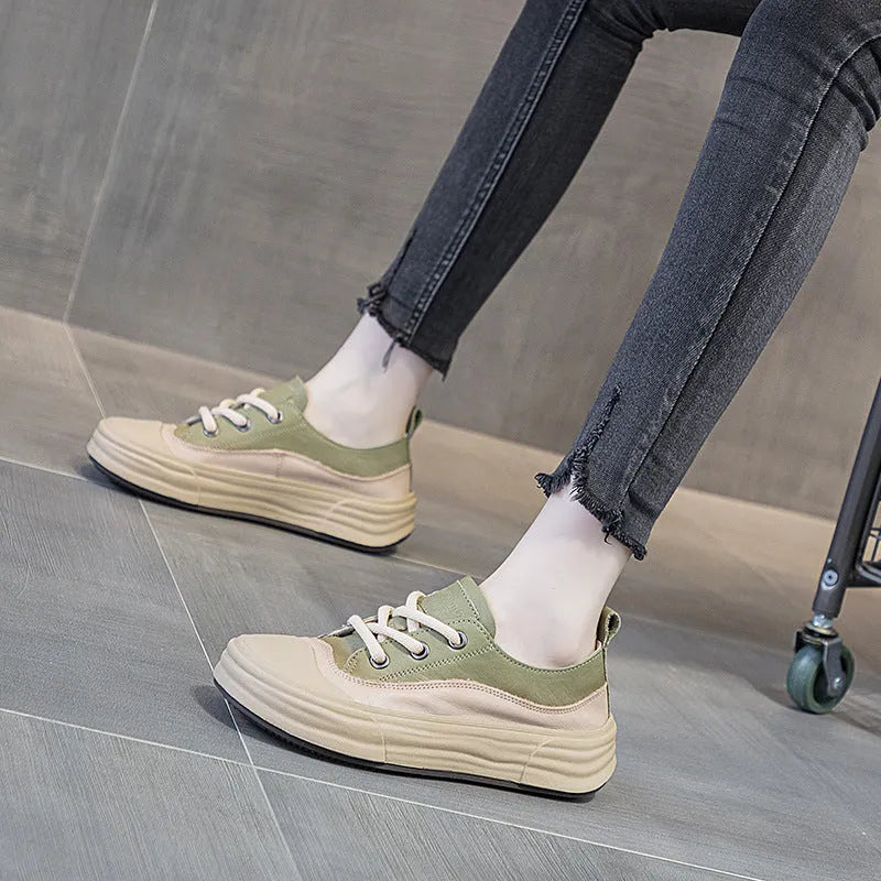 Women's leather platform sneakers in matcha green, purple and orange colours showing front lace-up design