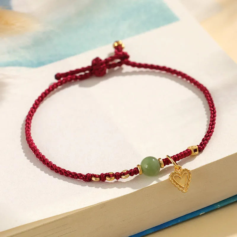 Handmade 925 silver bracelet with Hetian jade stone in woven design, available in red or dark red strap options