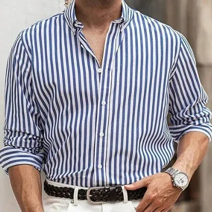 Man modelling a loose-fit khaki striped long sleeve casual button shirt.