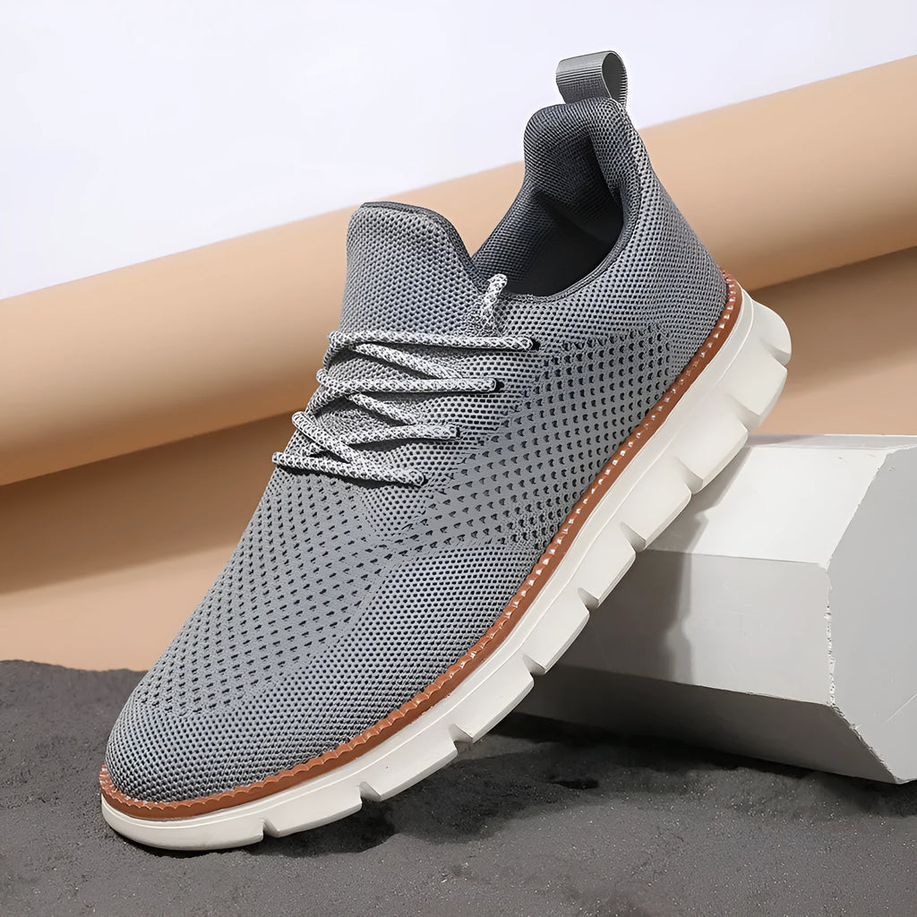 Men's grey and black mesh fabric casual sneakers with low heel and round toe.