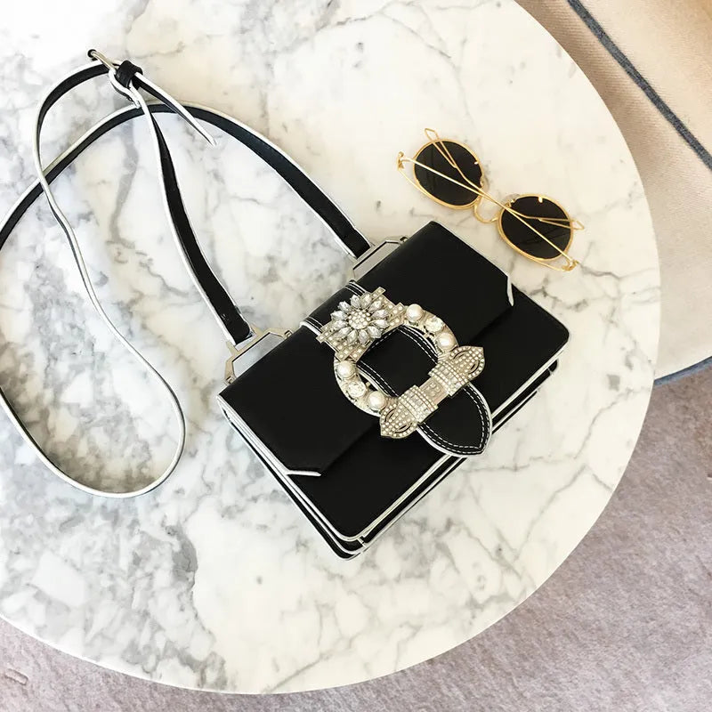 Designer diamond lock shoulder bag for women in quality PU leather, black colour option on display.