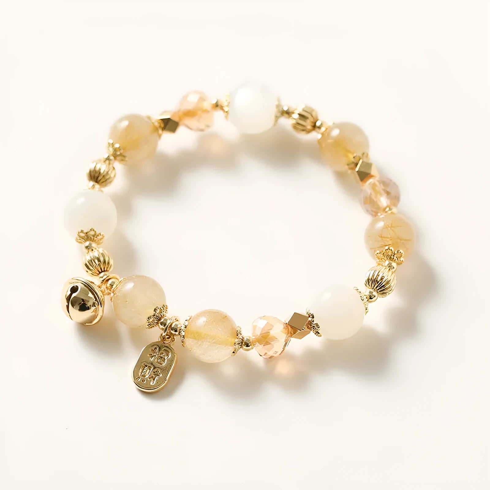 Korean style gold crystal bracelet with rutilated quartz stones and electroplated finish.