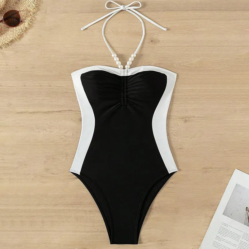 Women's black and white one-piece swimsuit with pearl spaghetti straps, slim-fitting nylon swimwear
