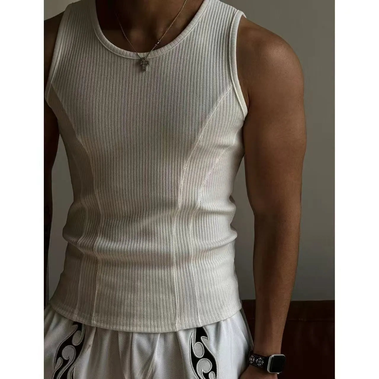Men's tight black polyester tank top with American stitching, shown from the front.