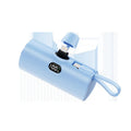 Capsule-shaped wireless power bank with digital display and built-in plug in five colour options.