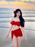 Women's red bikini swimsuit with puff sleeve skirt detail and matching briefs